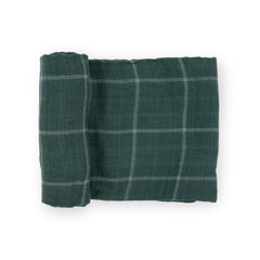 Little Unicorn evergreen plaid swaddle blanket showing breathable cotton softness for baby comfort.