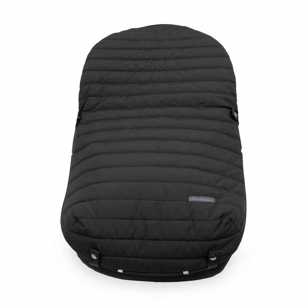 Little Unicorn footmuff with reflective tabs helps align topper to base safely.