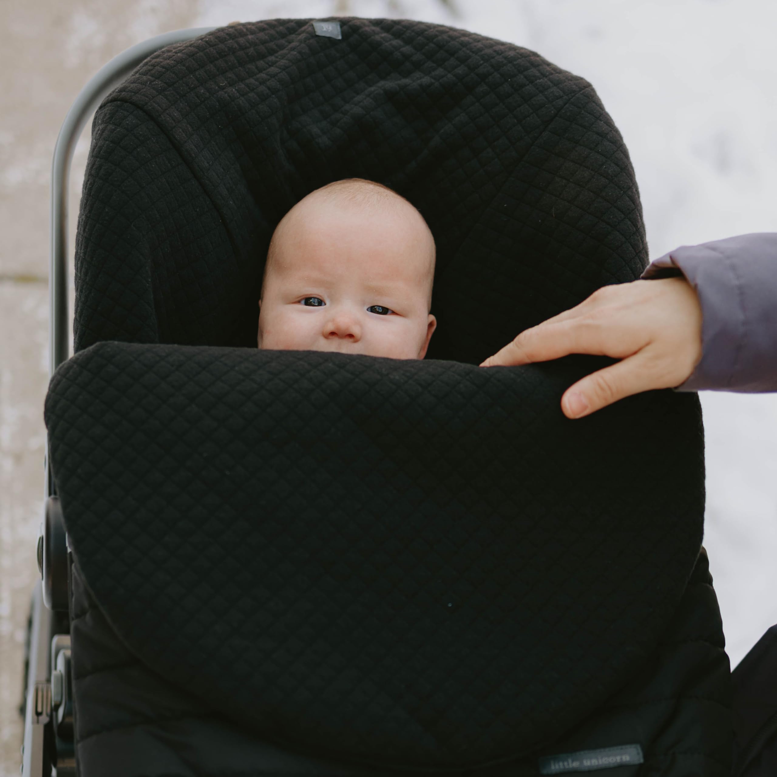 Little Unicorn wind and water-resistant exterior keeps baby warm and dry outdoors.
