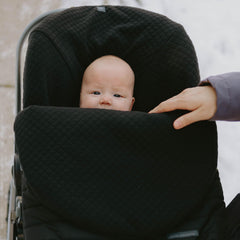 Little Unicorn wind and water-resistant exterior keeps baby warm and dry outdoors.