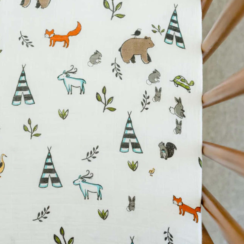 Elastic edge ensures a snug fit on the Little Unicorn Forest Friends sheet