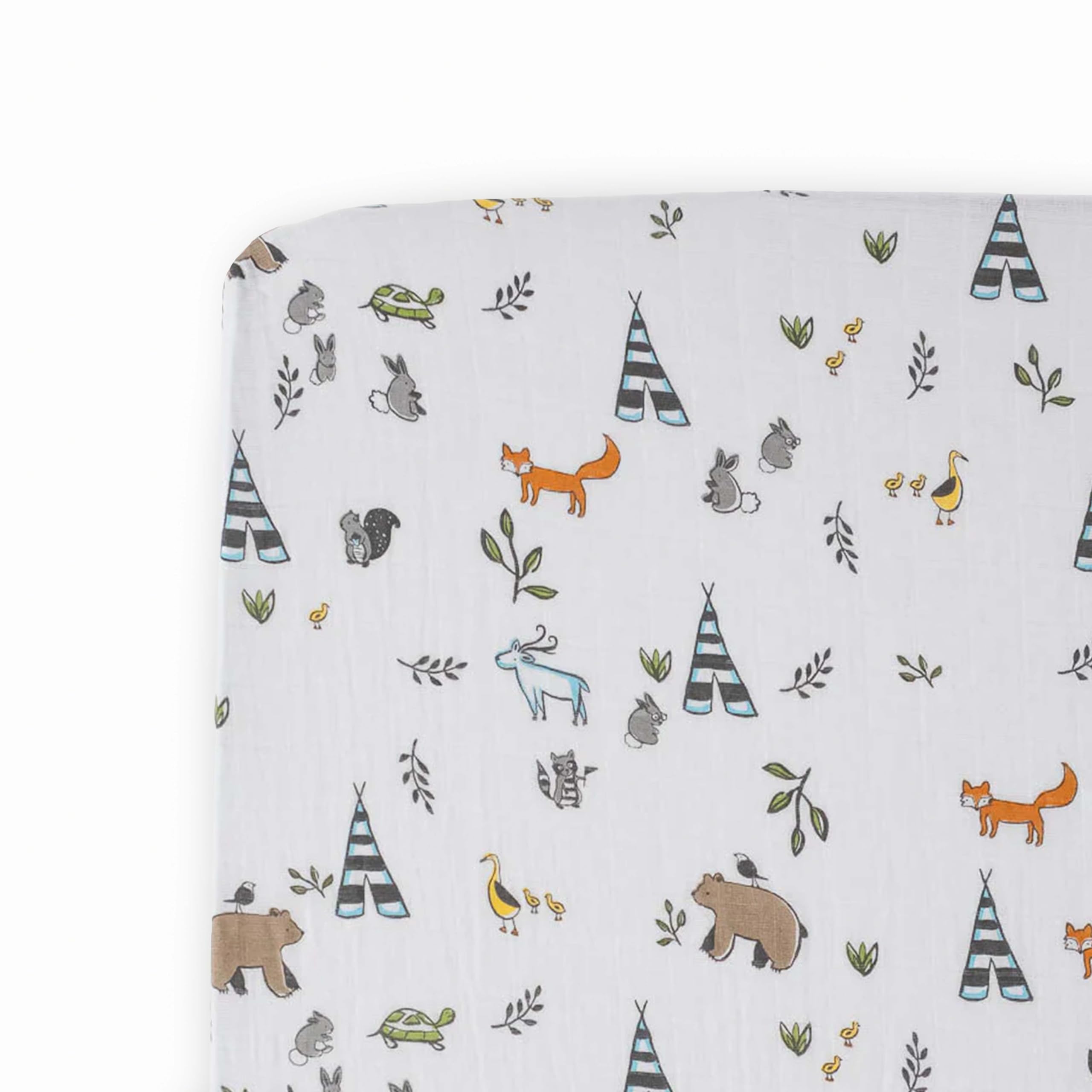 Little Unicorn Forest Friends crib sheet flatlay showcases breathable muslin softness