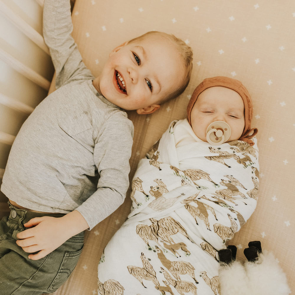 Little Unicorn lightweight travel blanket for simple on-the-go moments.