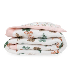 Little Unicorn Lofty Comforter crib-fit design highlights lightweight warmth for toddlers.