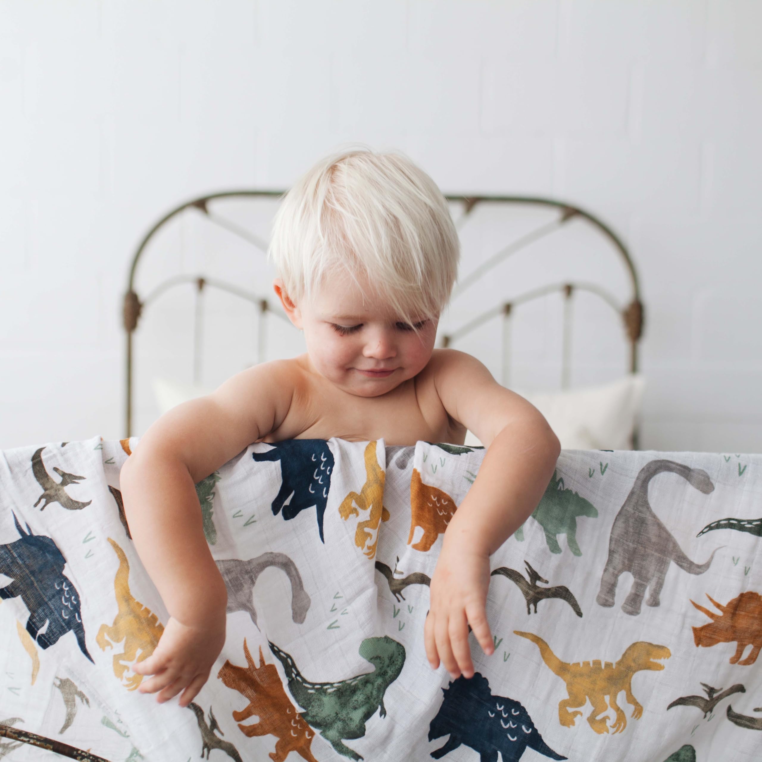 Little Unicorn muslin blanket 120x120 dino friends demonstrates generous size for swaddling and coverage.