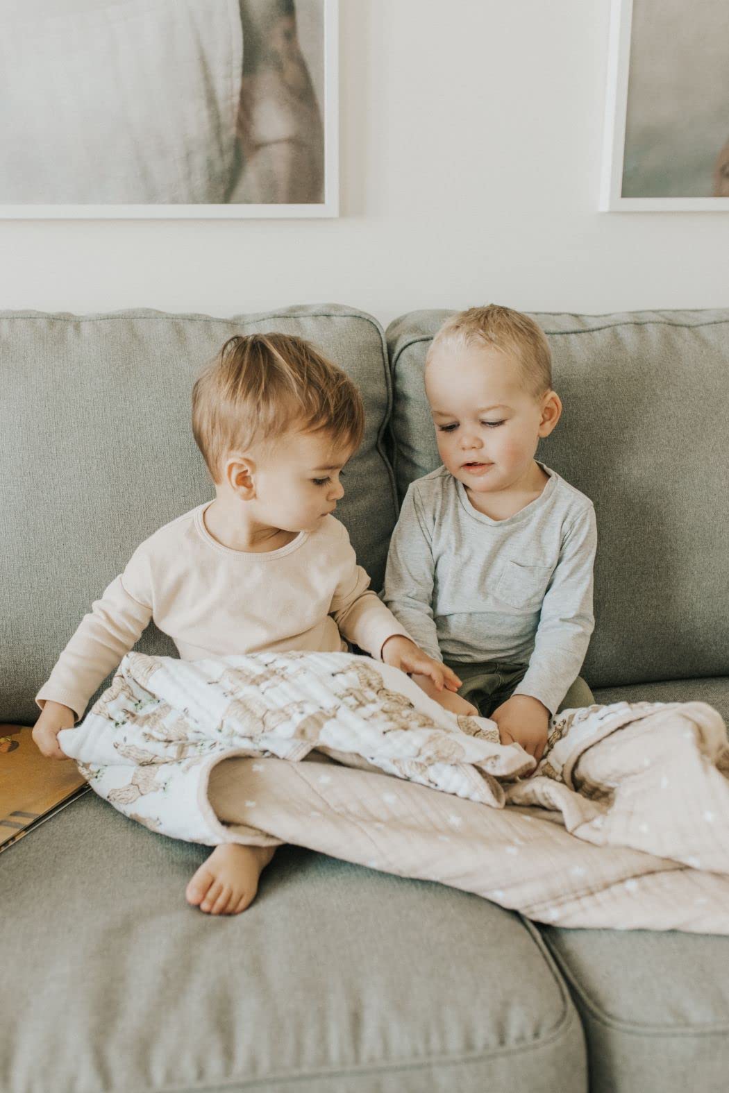 Little Unicorn Muslin Quilt folded travel-friendly demonstrates compact, lightweight warmth for on-the-go use.