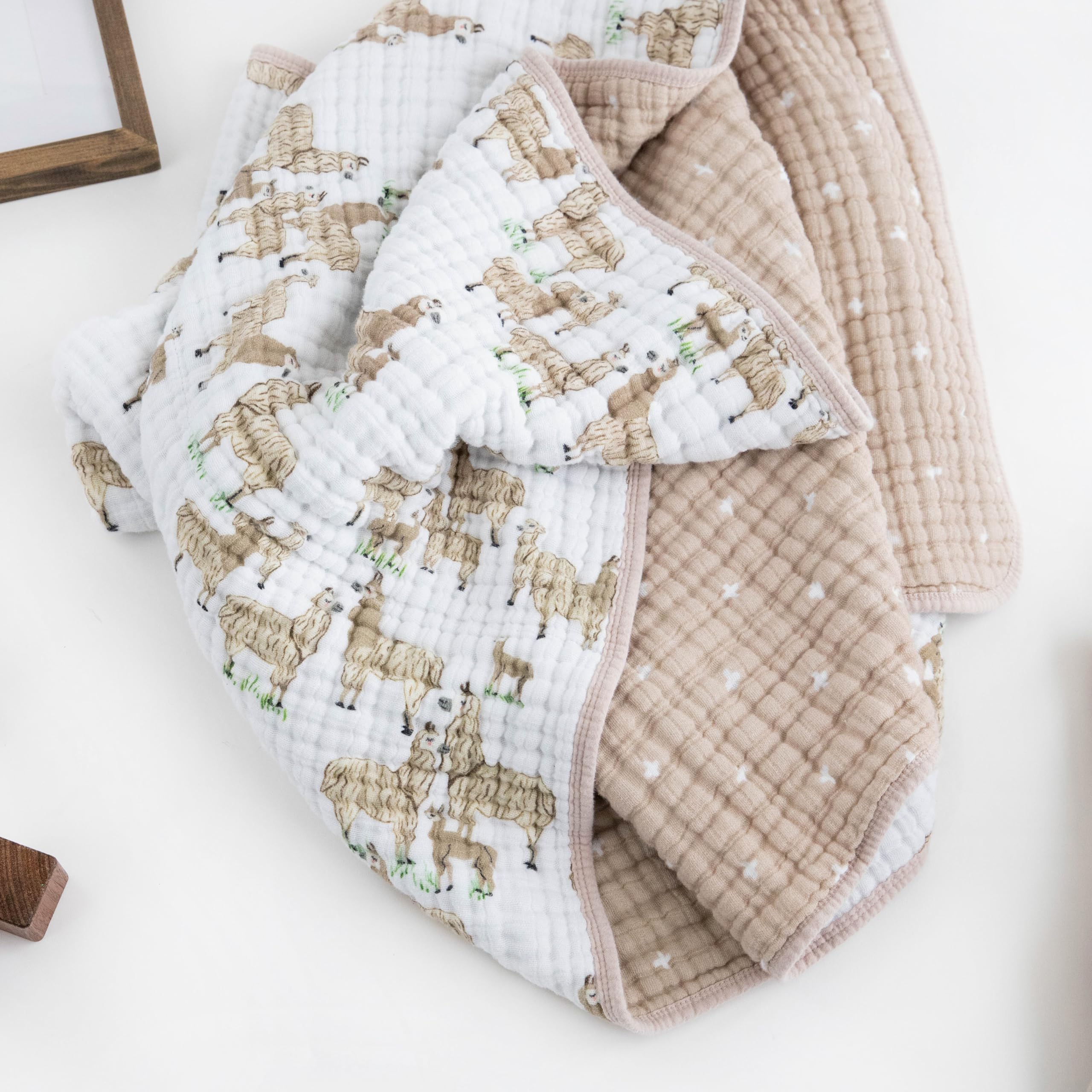 Little Unicorn Muslin Quilt gift-ready presentation simplifies baby shower gifting.