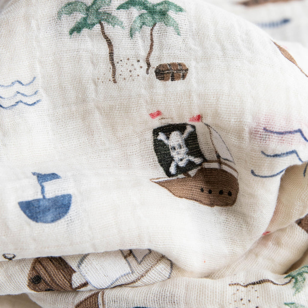 Little Unicorn muslin swaddle with check pattern offers soft, versatile everyday wrapping.