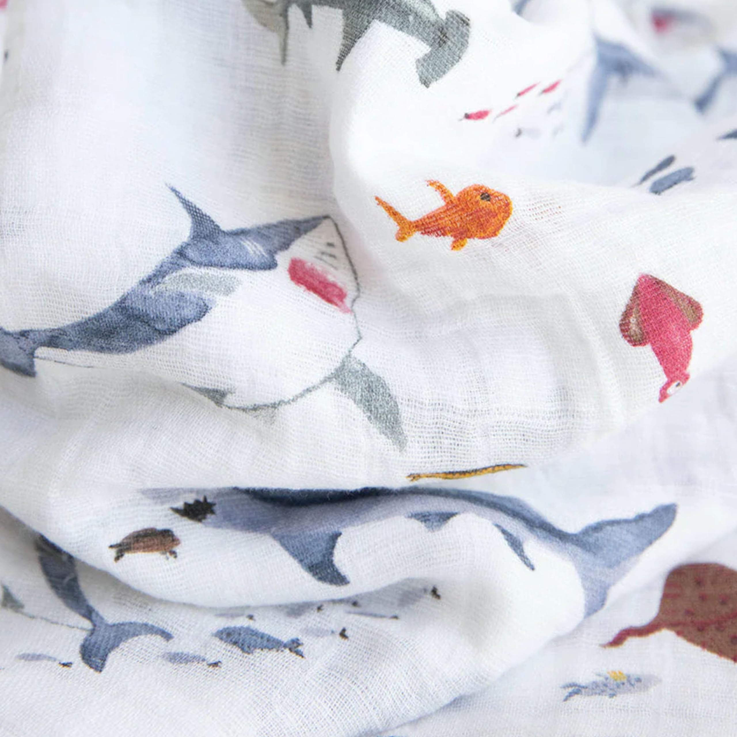 Little Unicorn muslin swaddle solid color provides lightweight, easy-care comfort on the go.