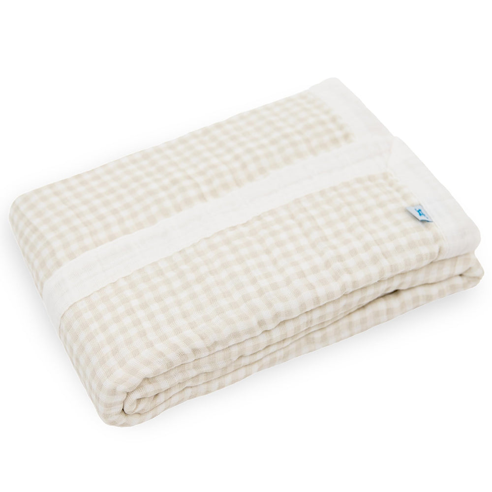 Little Unicorn newborn quilt used as stroller cover providing lightweight, breathable protection.