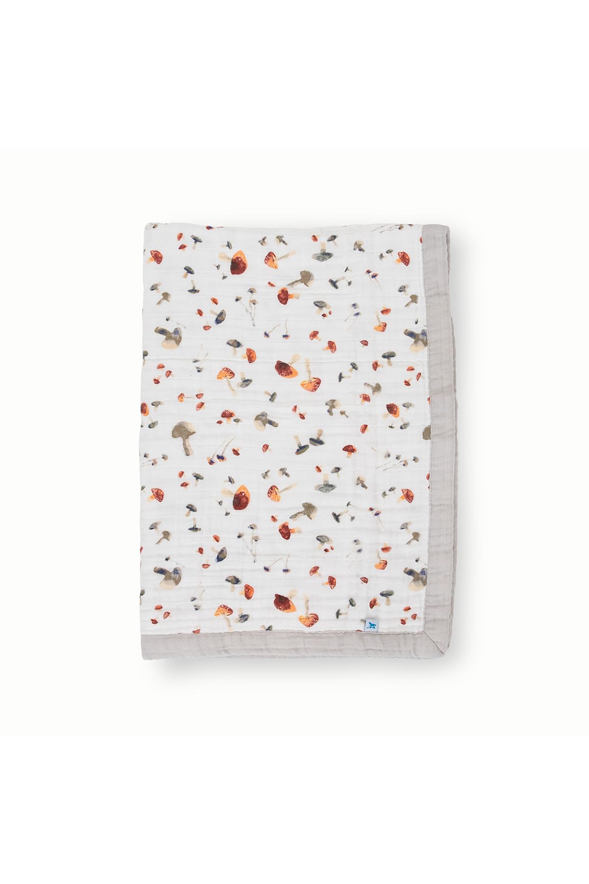 Little Unicorn newborn receiving quilt mushrooms close-up, breathable muslin for gentle warmth
