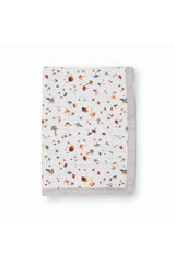 Little Unicorn newborn receiving quilt mushrooms close-up, breathable muslin for gentle warmth