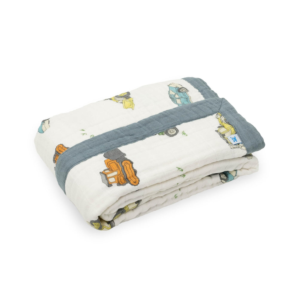 Little Unicorn newborn receiving quilt on-stroller shows portable warmth for on-the-go days