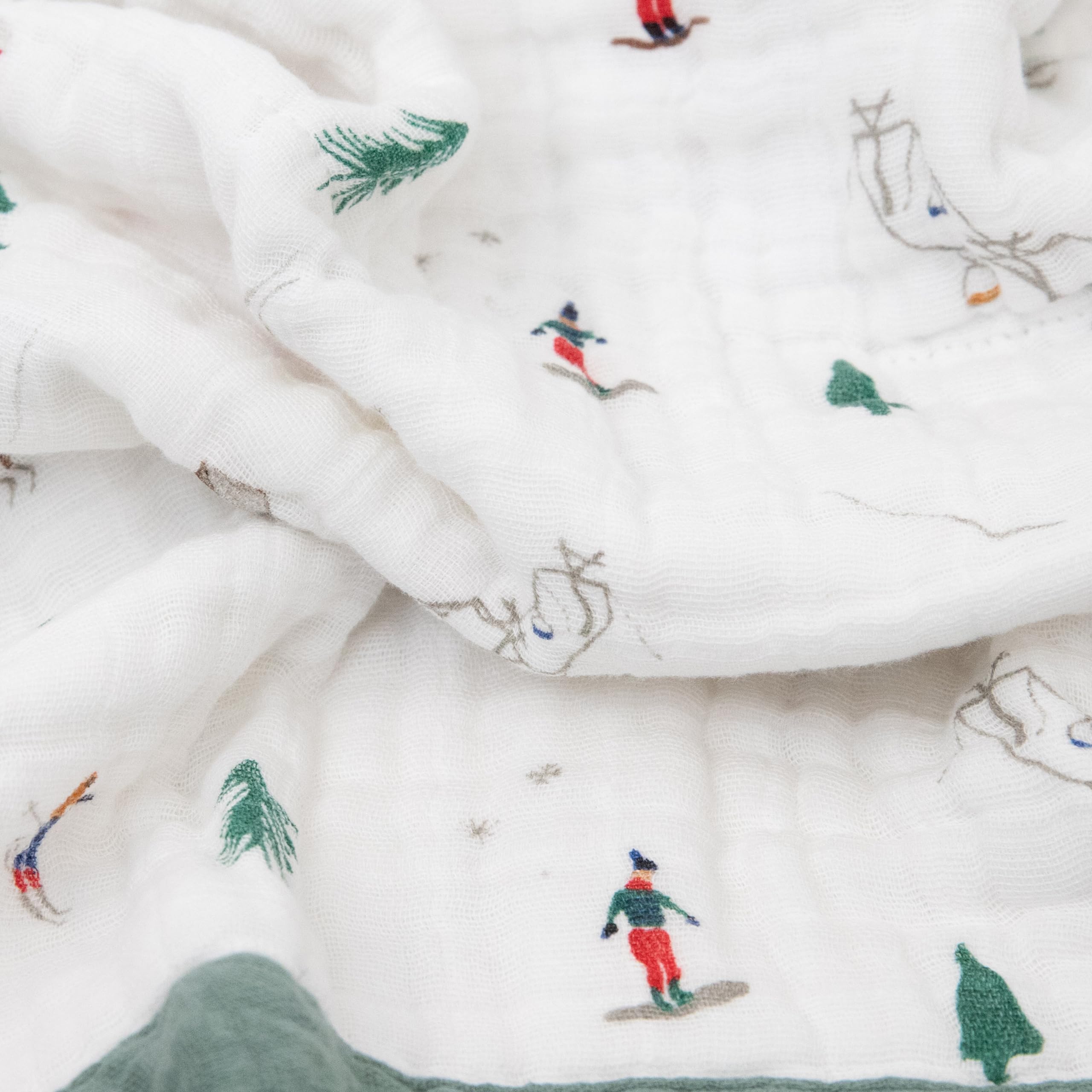 Little Unicorn newborn receiving quilt used as stroller cover in Powder Party for on-the-go comfort