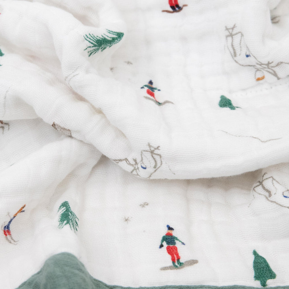 Little Unicorn newborn receiving quilt used as stroller cover in Powder Party for on-the-go comfort