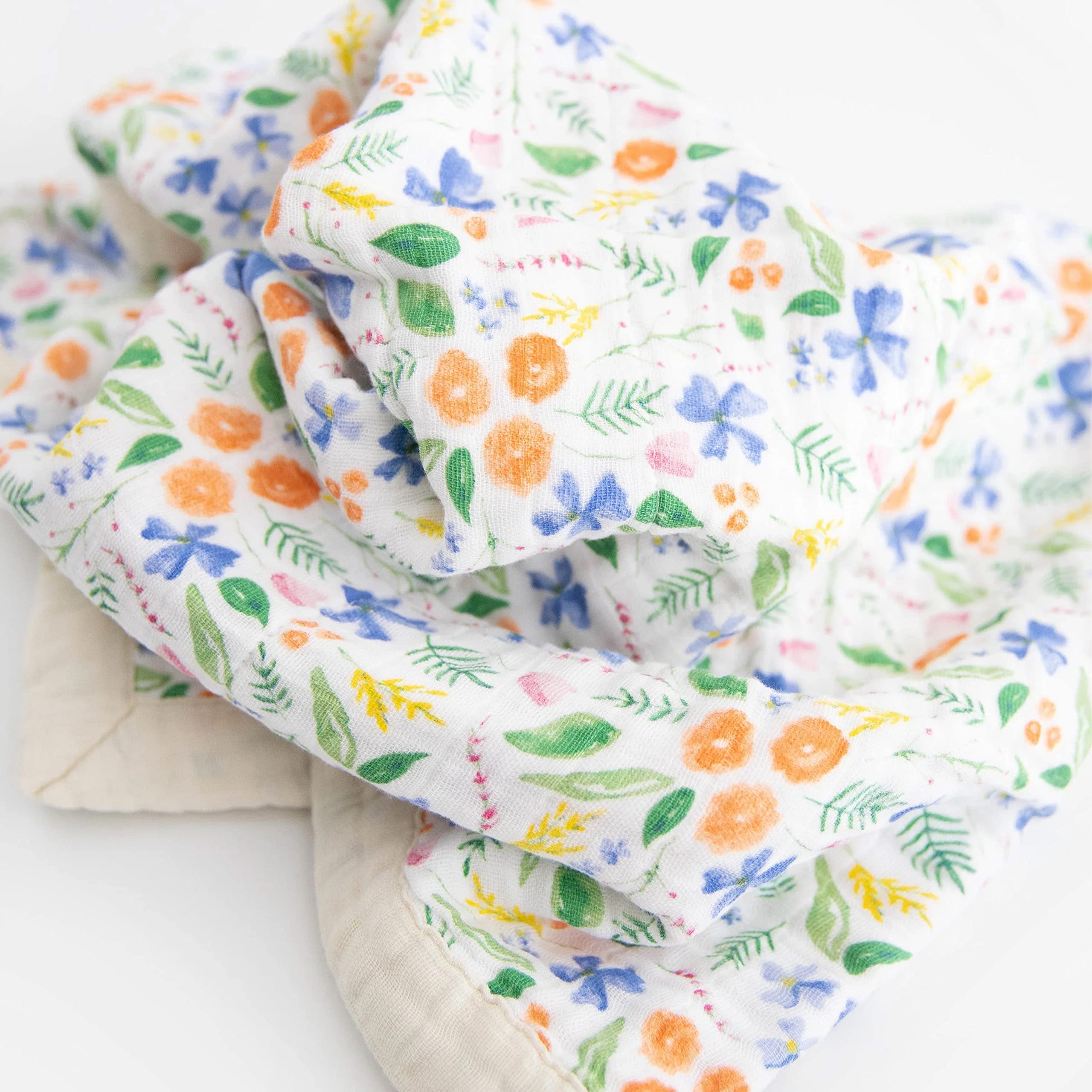 Little Unicorn on-the-go blanket; stroller cover for travel-friendly comfort.