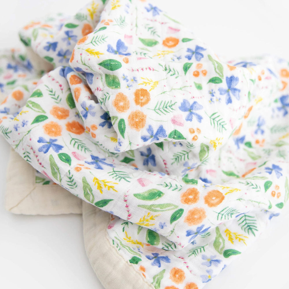 Little Unicorn on-the-go blanket; stroller cover for travel-friendly comfort.