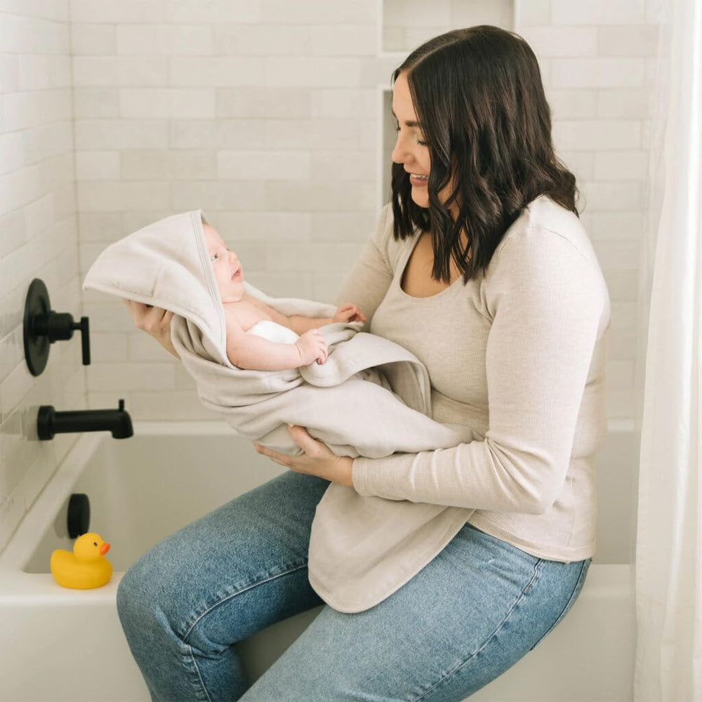 Little Unicorn porpoise hooded towel back view highlights cozy wrap and secure hood.