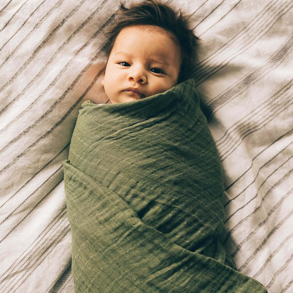 Little Unicorn Fern swaddle in a nursery, gender-neutral and stylish.