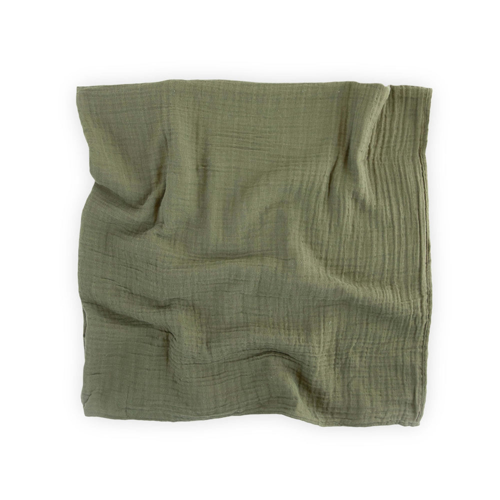 Little Unicorn Fern swaddle texture up close, soft cotton muslin fibers.