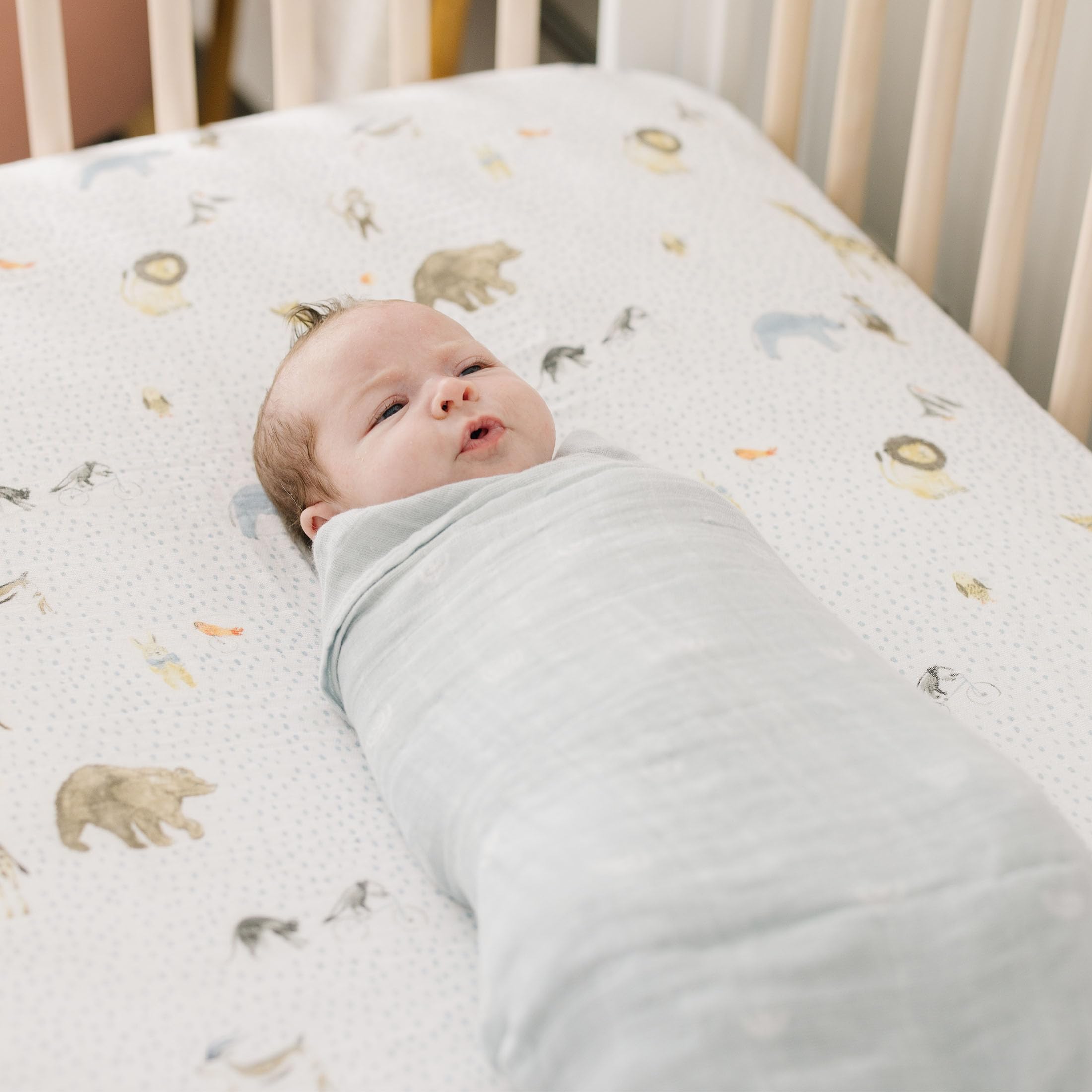 Little Unicorn swaddle with burp cloth use for easy cleanup