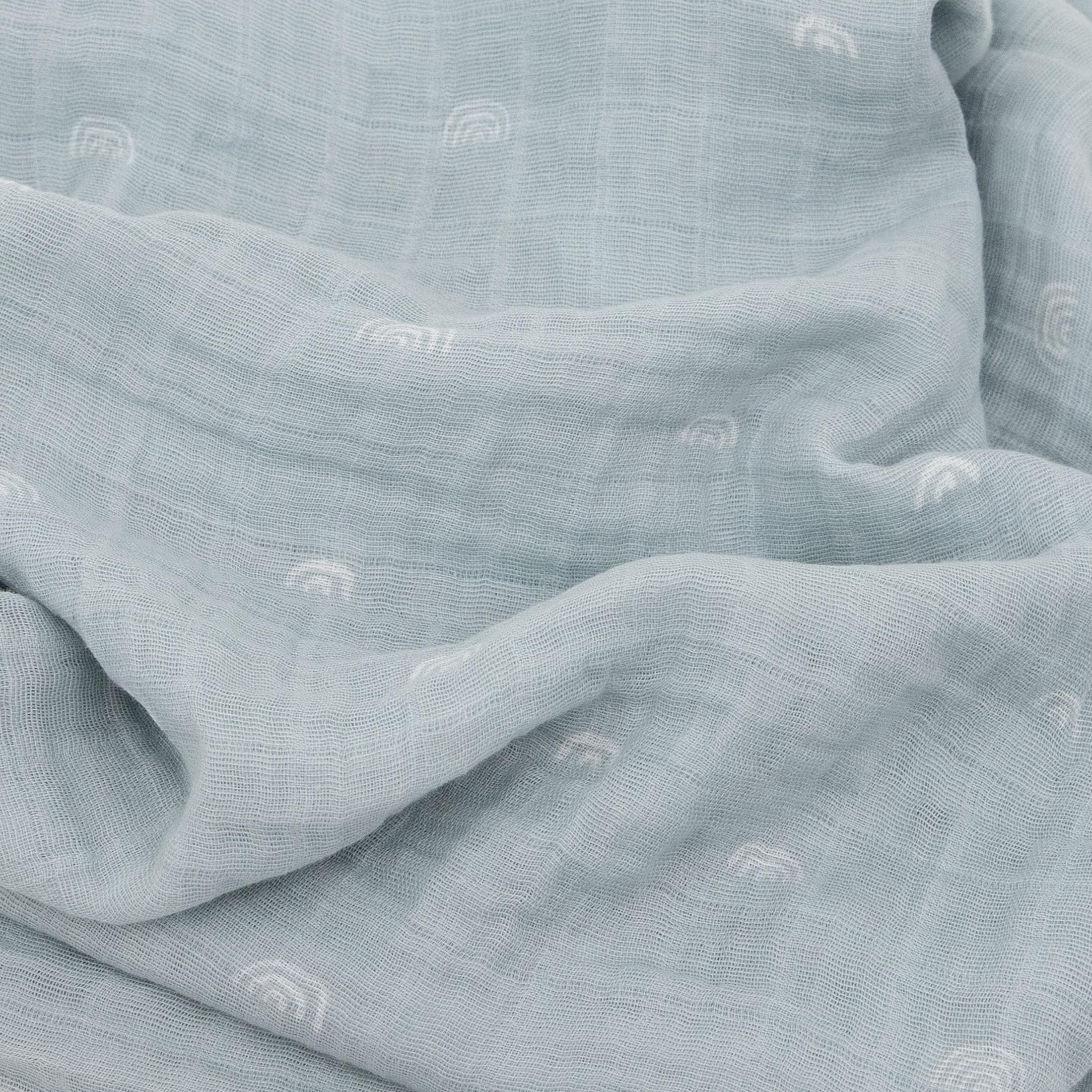 Little Unicorn swaddle wrapped baby showcasing soft fabric and secure fit