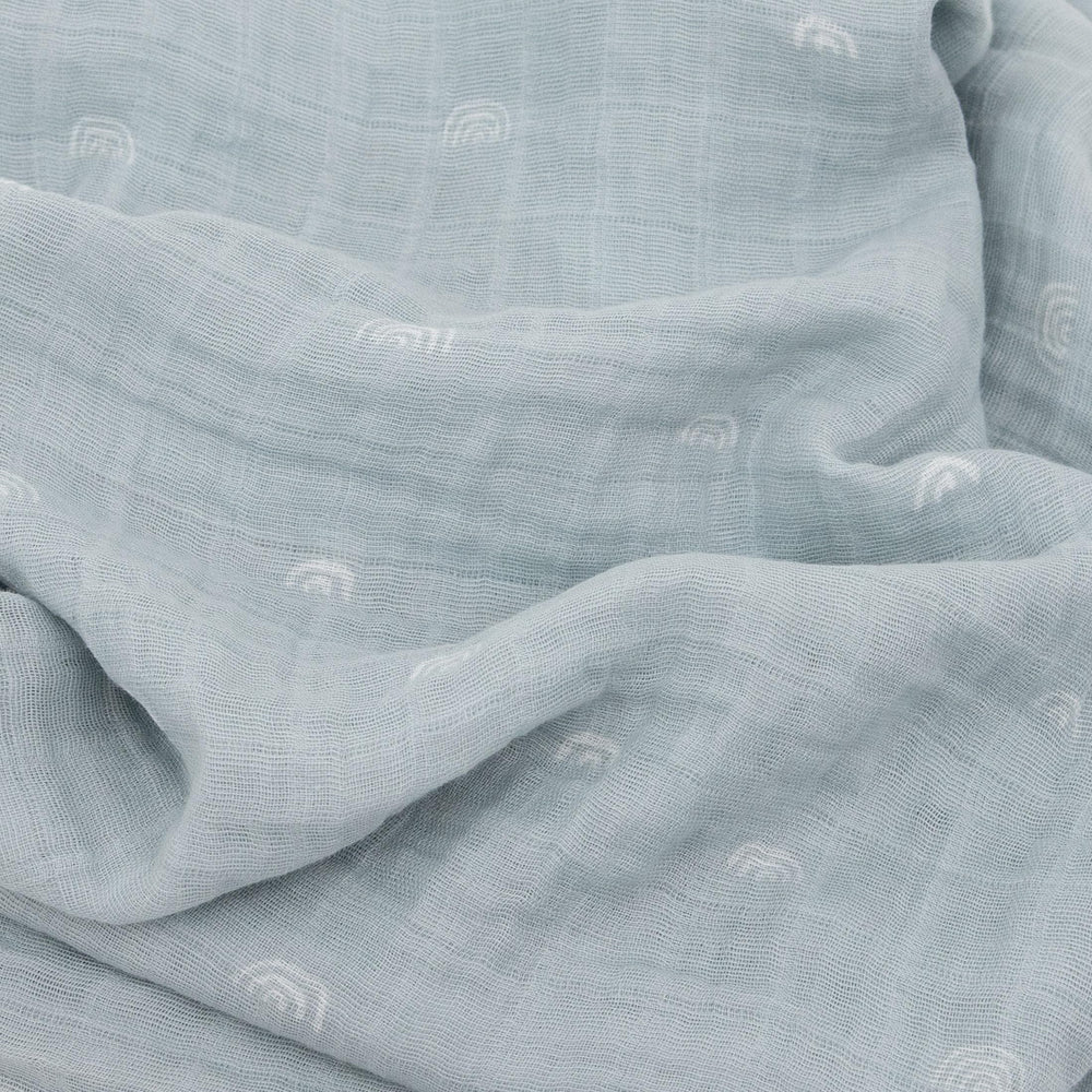 Little Unicorn swaddle wrapped baby showcasing soft fabric and secure fit