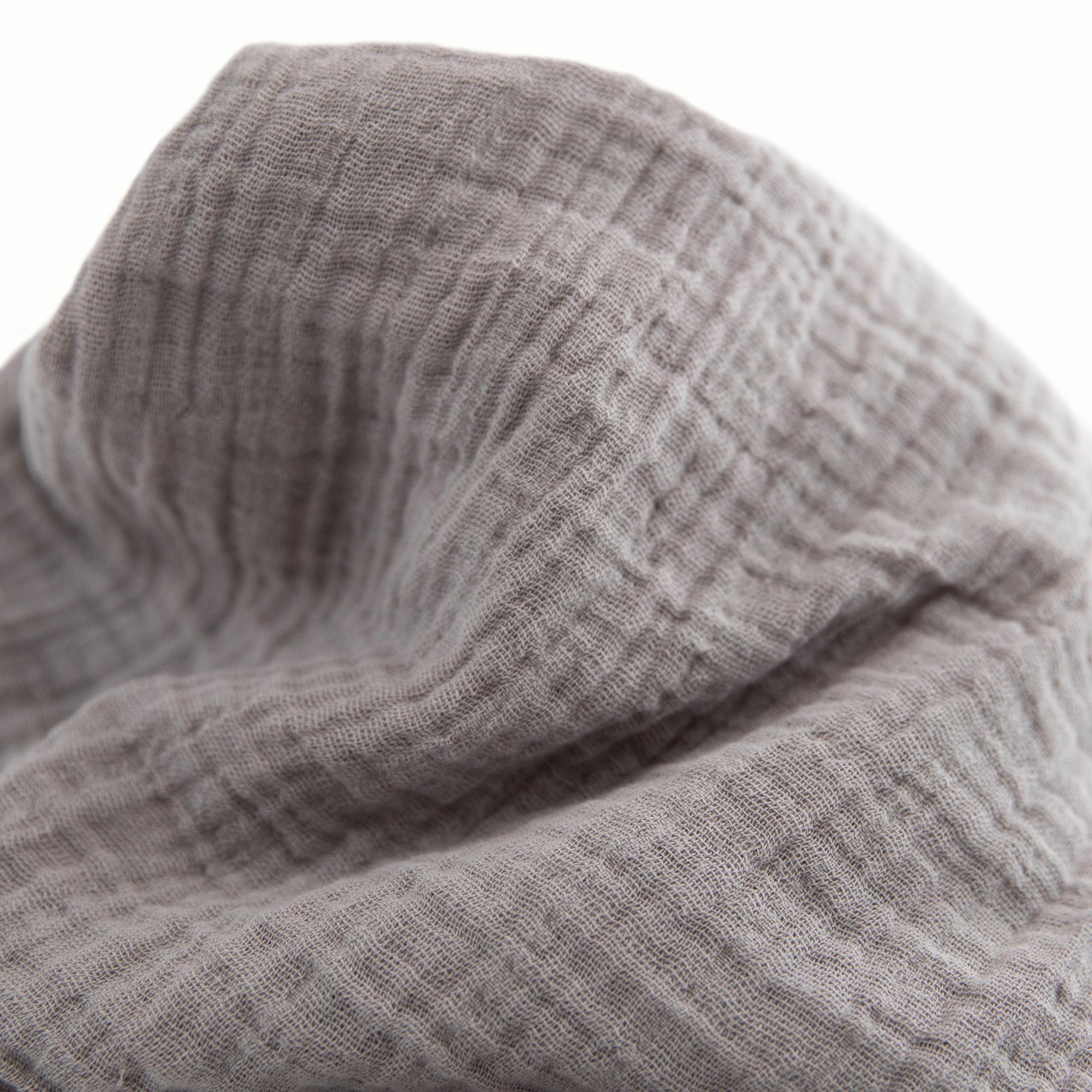 Little Unicorn swaddle with check pattern for versatile nursery style