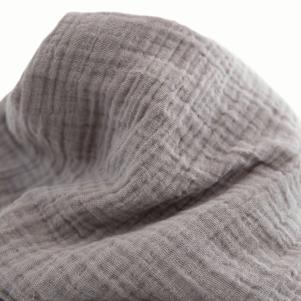 Little Unicorn swaddle with check pattern for versatile nursery style