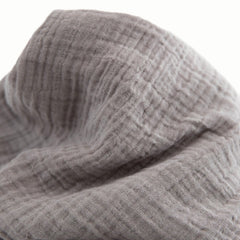 Little Unicorn swaddle with check pattern for versatile nursery style