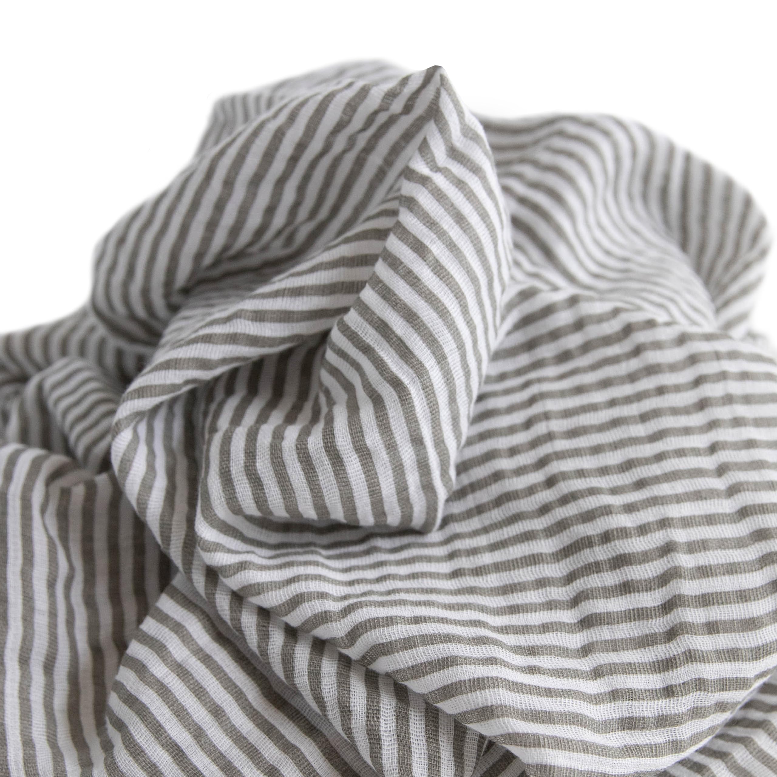 Little Unicorn swaddle on baby with breathable muslin for comfort