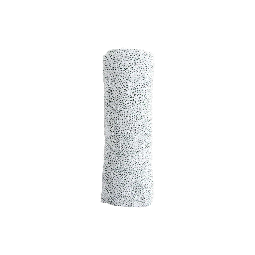 Little Unicorn swaddle used for multi-use play and snuggle moments.