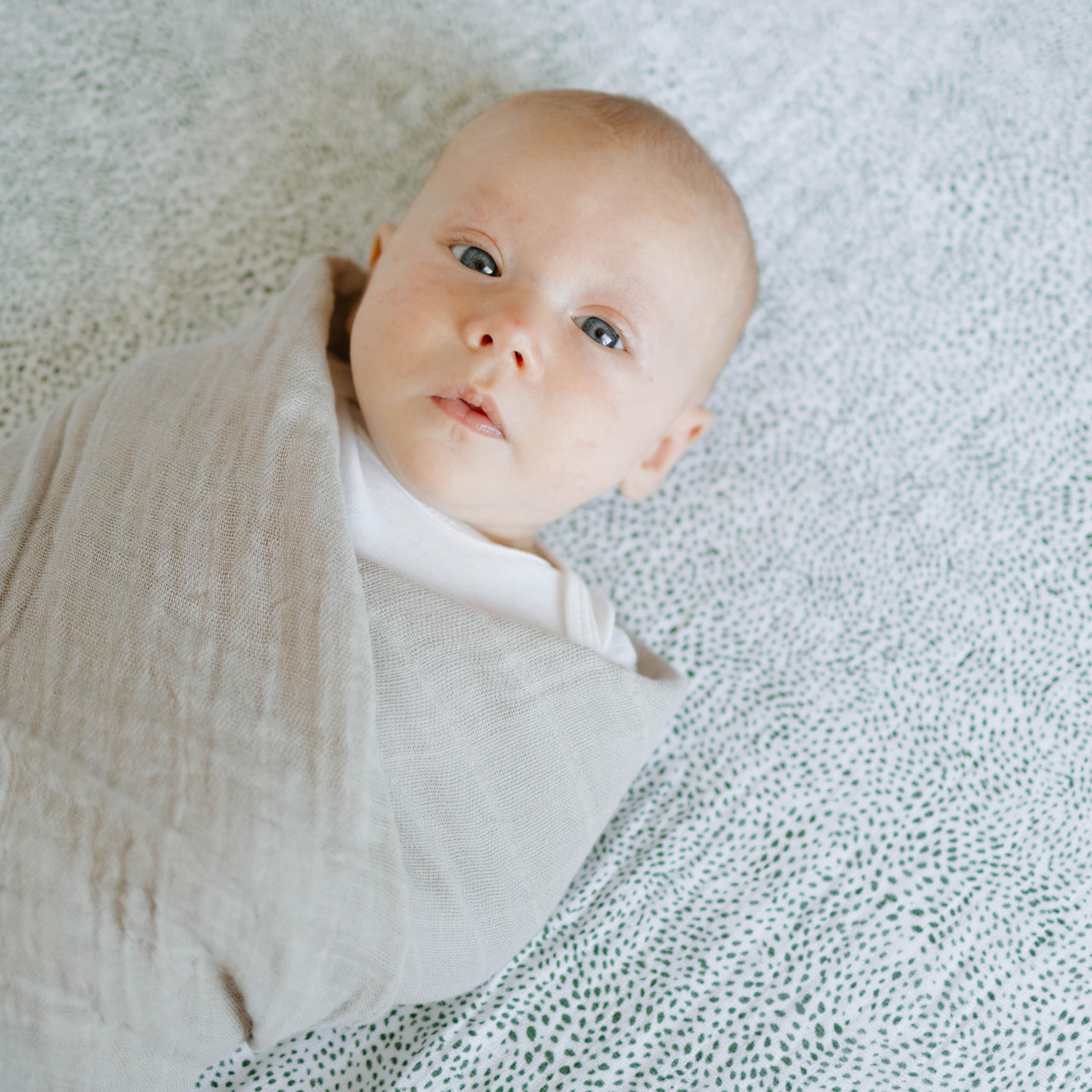 Travel ready Little Unicorn swaddle doubles as light blanket