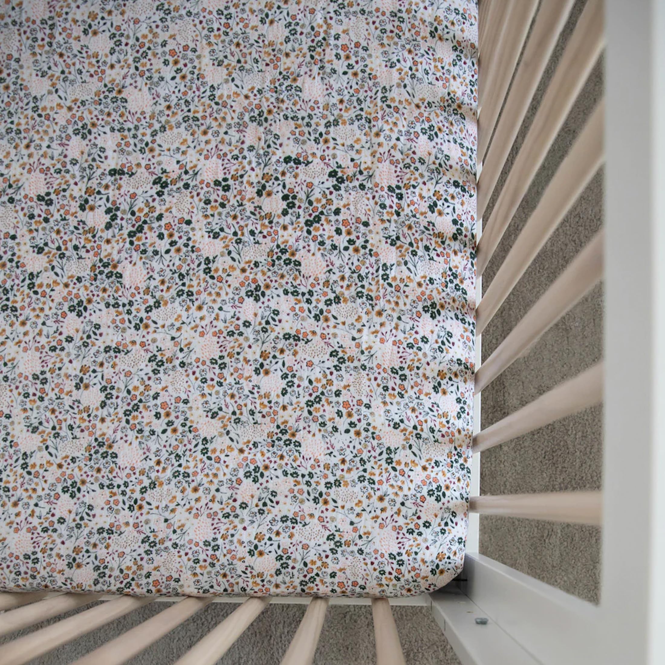 Little Unicorn Crib Sheet in a cozy nursery decor setup.