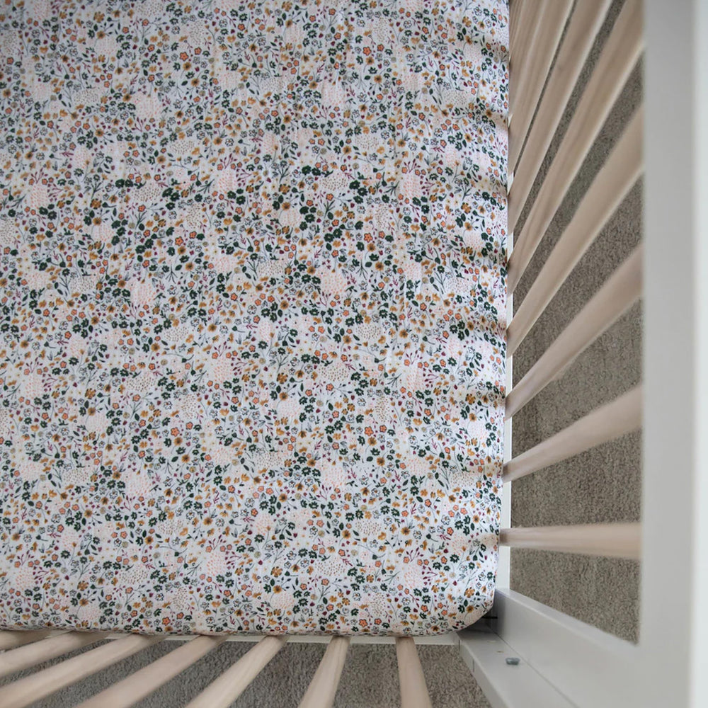 Little Unicorn Crib Sheet in a cozy nursery decor setup.