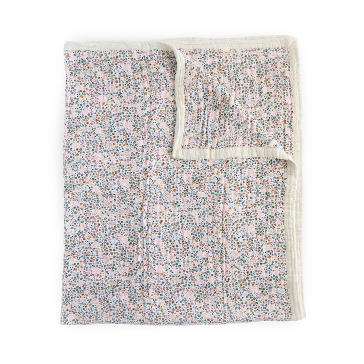 Little Unicorn Premium Quilted Throw close-up reveals four-layer muslin softness for cozy cuddles.