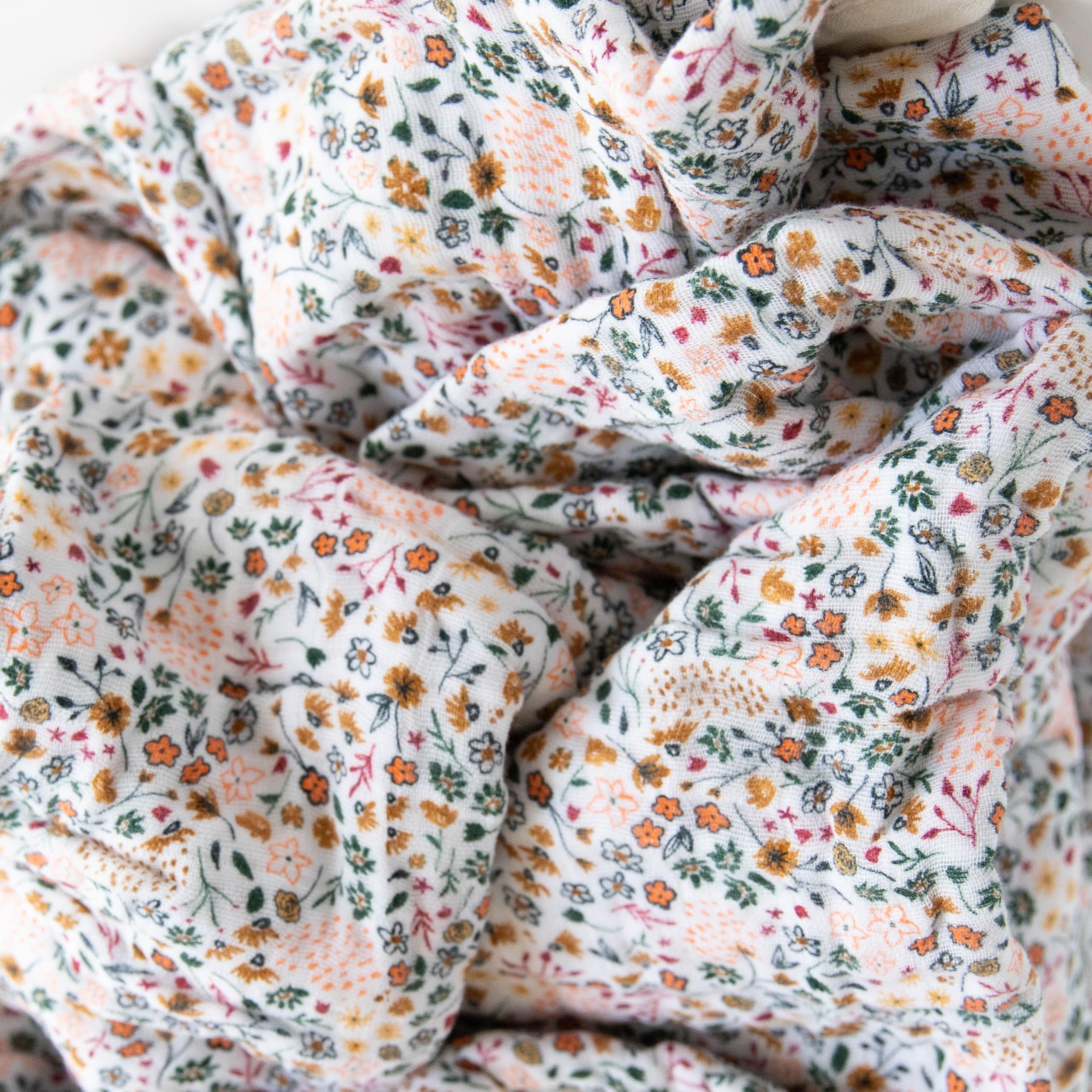 Little Unicorn Premium Quilted Throw used as stroller cover demonstrates on-the-go snuggles.