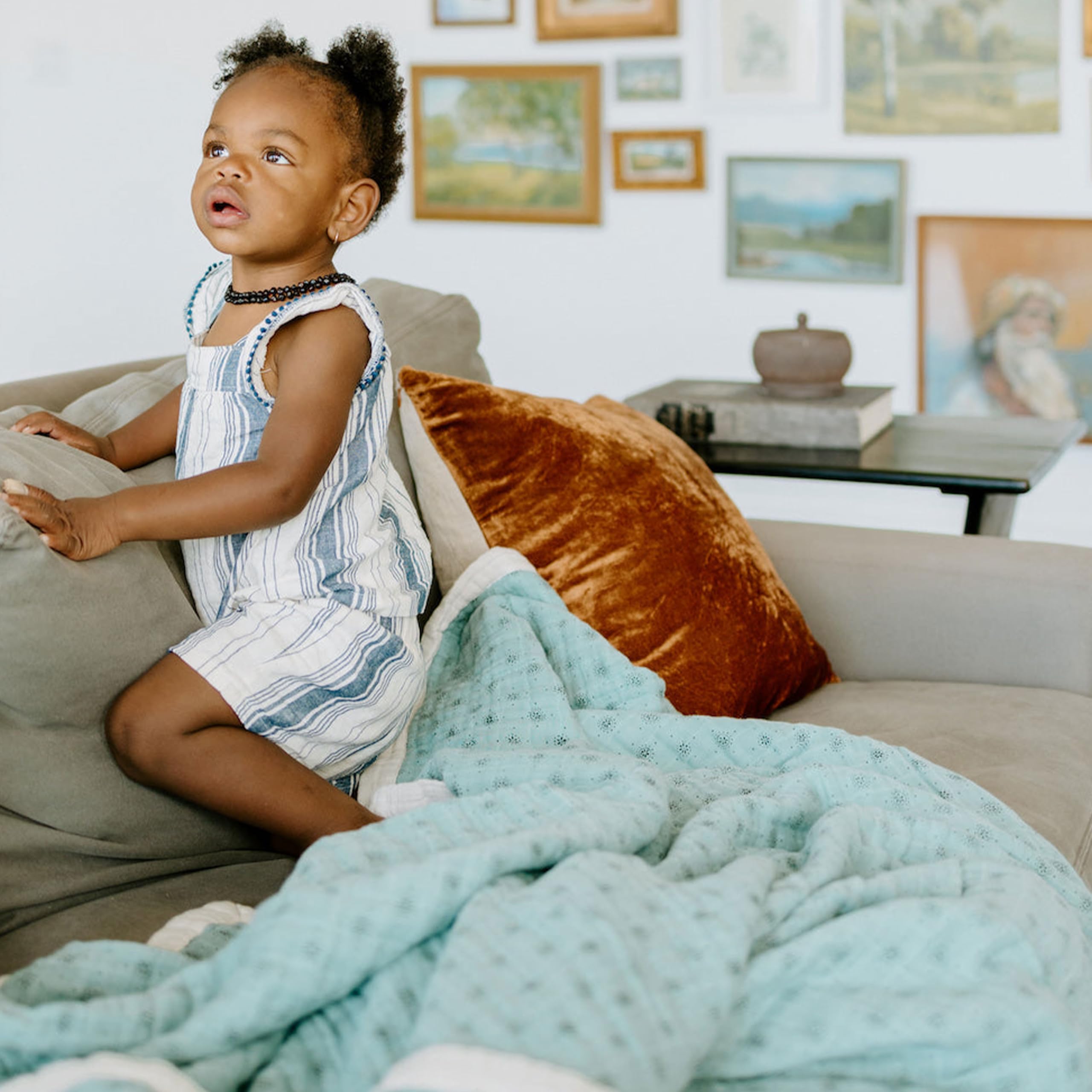 Little Unicorn premium quilted throw highlighting breathable muslin for comfortable warmth.