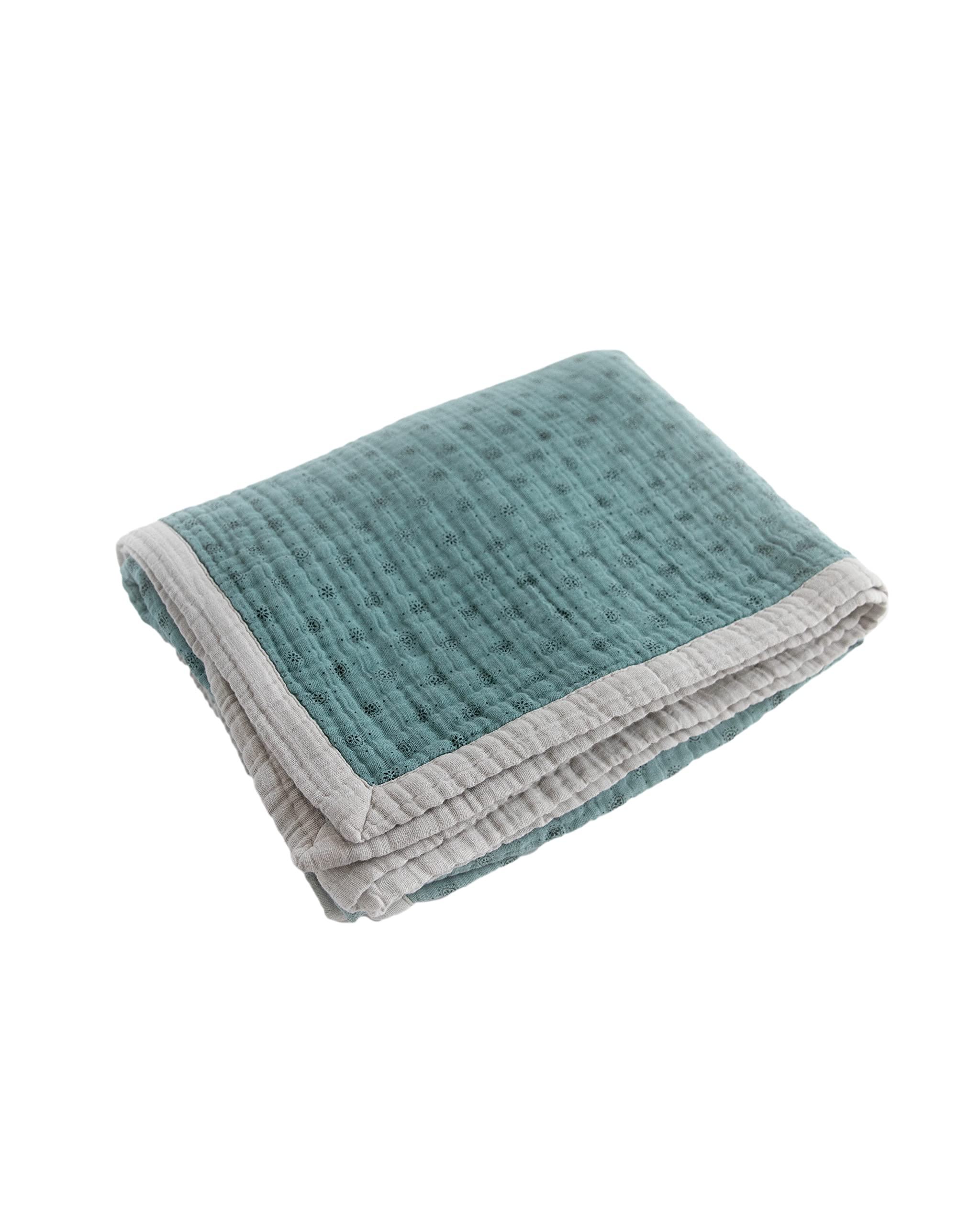Little Unicorn premium quilted throw with detailed stitching and bias binding on edges.