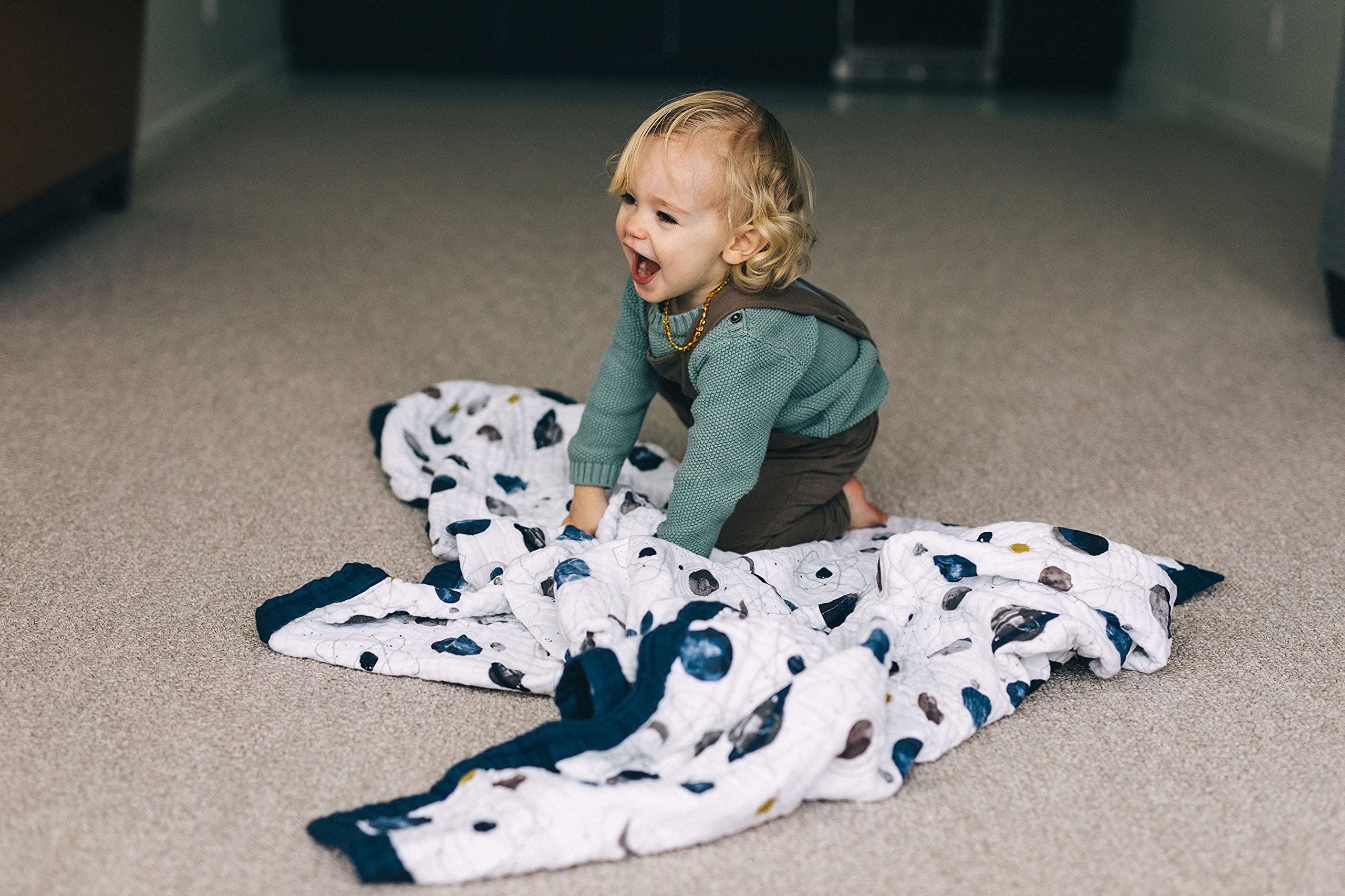 Little Unicorn Premium Quilted Throw features durable stitching for daily use.