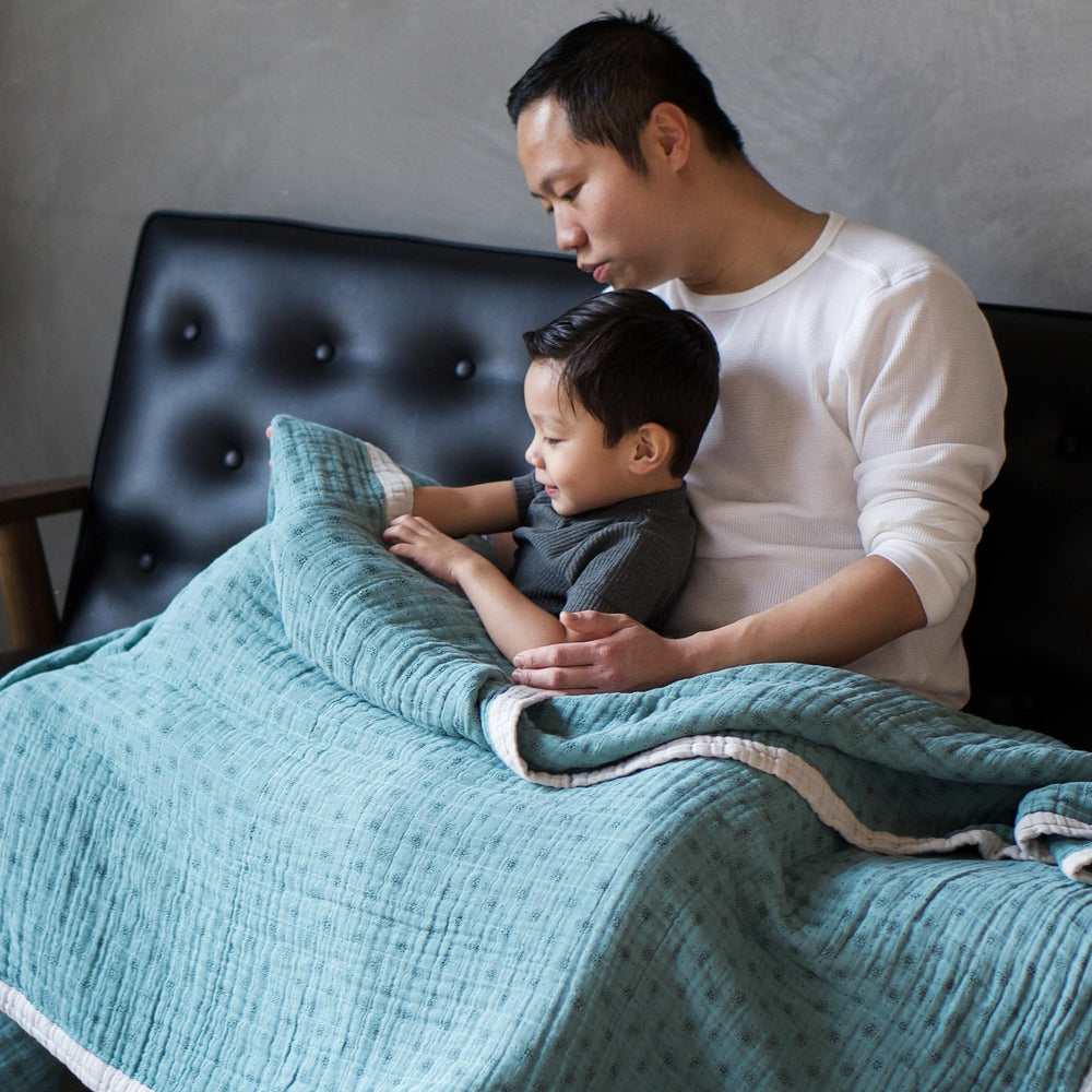 Little Unicorn premium quilted throw is machine washable and easy to care for.