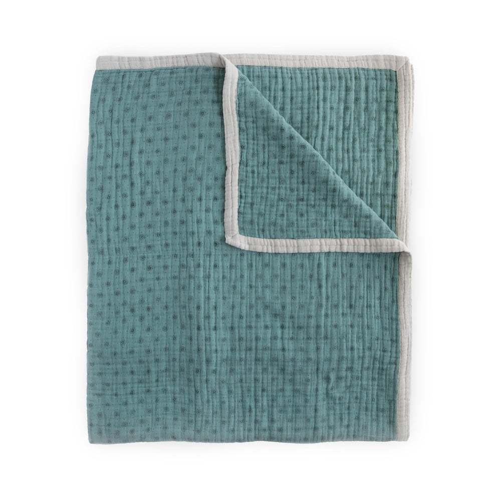 Little Unicorn premium quilted throw close-up of soft muslin for cozy naps.