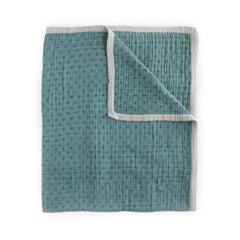 Little Unicorn premium quilted throw close-up of soft muslin for cozy naps.