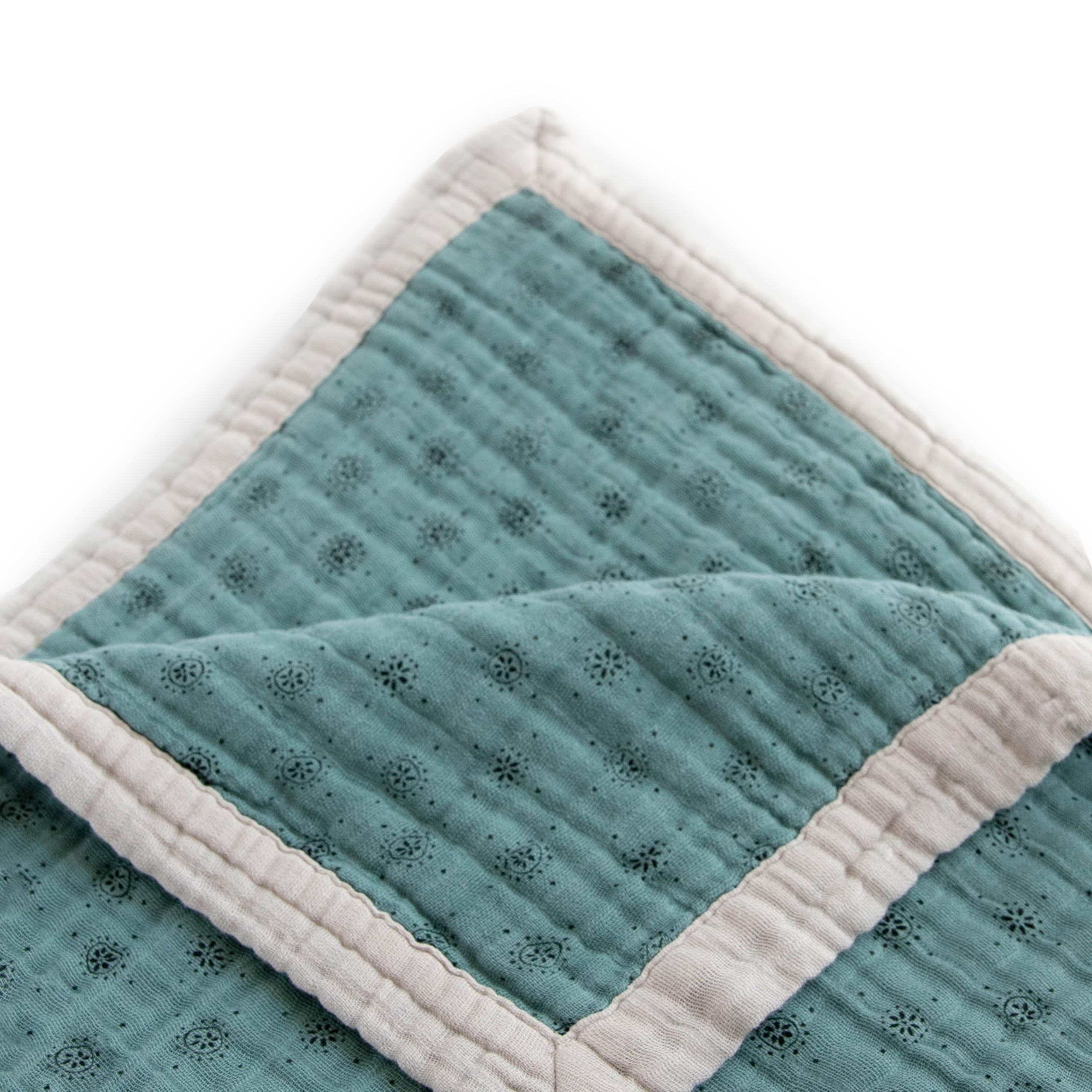 Little Unicorn premium quilted throw used as a stroller cover for on-the-go snuggles.