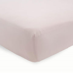 Little Unicorn sheet on standard crib mattress demonstrates a snug, secure fit