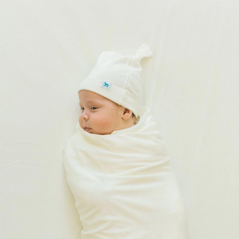 Little Unicorn soft stretch-knit crib sheet close-up, OEKO-TEX certified fabric