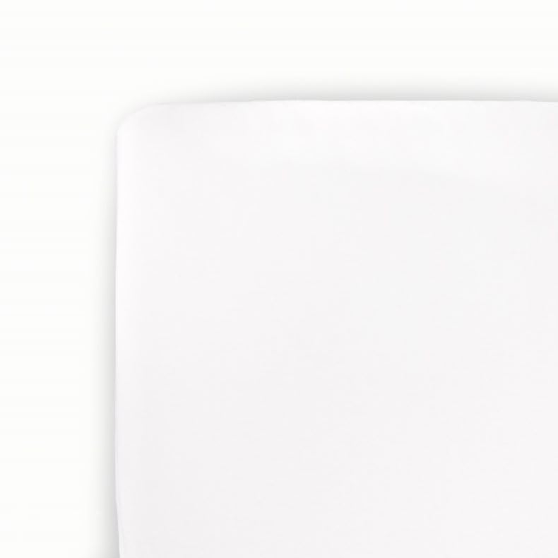 Little Unicorn stretch knit crib sheet in white, flat lay, highlighting softness and quality