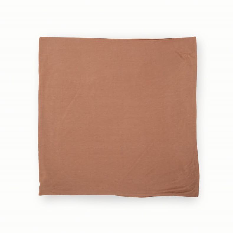 Little Unicorn pressed petals swaddle blanket beside nursing moment signals simple daily comfort