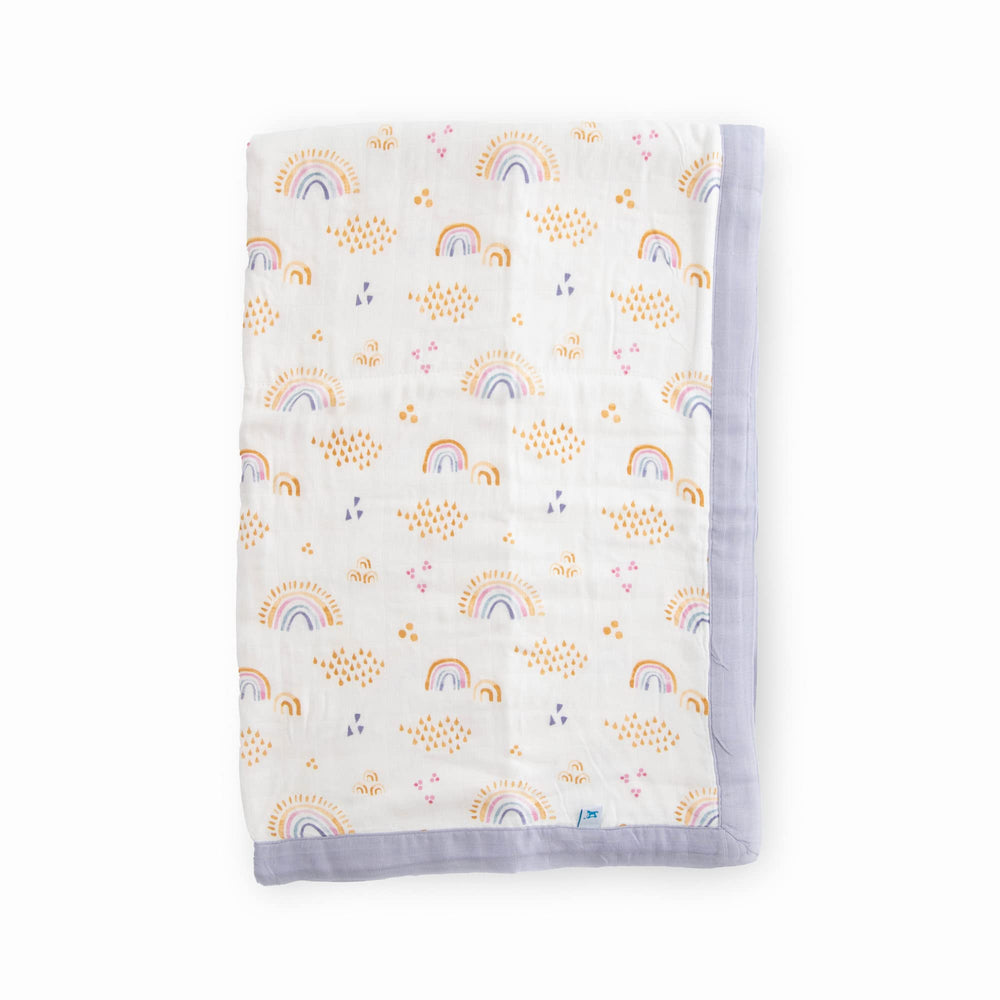Little Unicorn Rainbows & Raindrops Deluxe Muslin Quilt texture highlights soft bamboo rayon for gentle baby snuggles