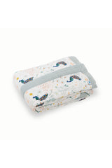 Little Unicorn quilt multi-layer muslin design provides breathable warmth for outings.